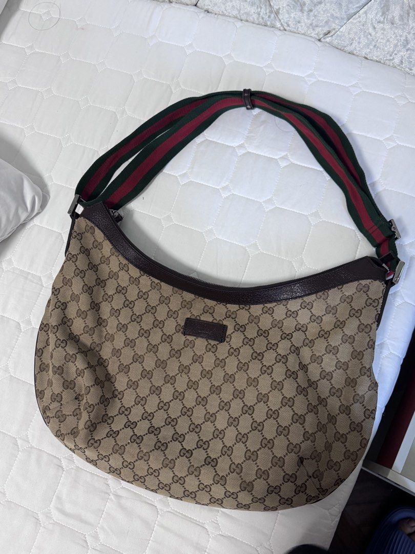 Gucci Canvas Web Half Moon Crossbody bag (Category: Luxury Bags & Wallets) located in Quezon City. Submitted by tresmarias.arc (Listing ID 1462433951, Image 1). Description: Gucci Canvas Web Half Moon Crossbody bag Rank A, good condition With dustbag Negotiable.