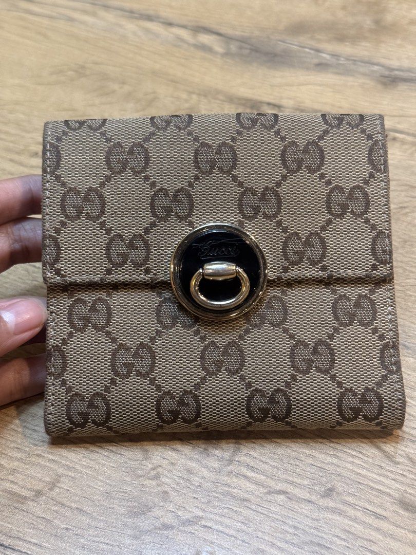 Gucci GG Canvas Wallet with Lock Closure (Category: Luxury Bags & Wallets) located in Pasig City. Submitted by riusables (Listing ID 1462359481, Image 1). Description: - Authentic Gucci wallet - Classic GG canvas pattern - Secure front lock closure - Multiple interior card slots and compartments - Black leather lining - Condition: 9/10 - Price negotiable Rfs: need funds .