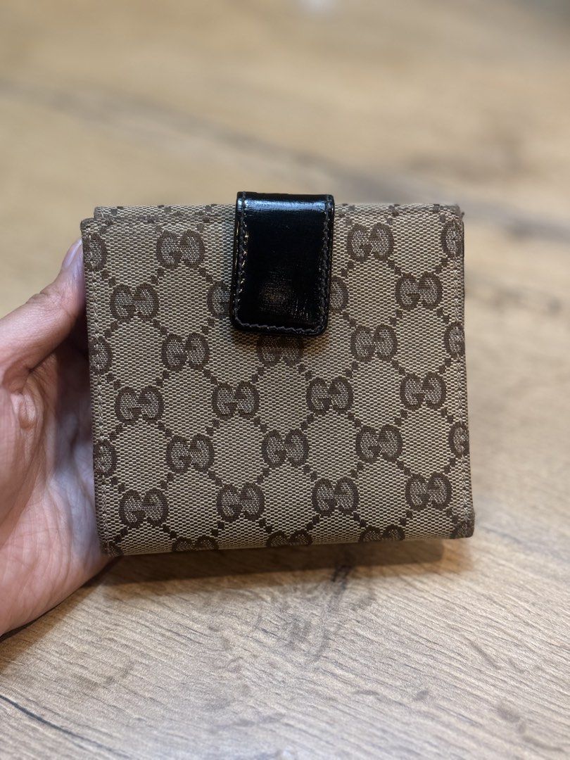Gucci GG Canvas Wallet with Lock Closure (Category: Luxury Bags & Wallets) located in Pasig City. Submitted by riusables (Listing ID 1462359481, Image 3). Description: - Authentic Gucci wallet - Classic GG canvas pattern - Secure front lock closure - Multiple interior card slots and compartments - Black leather lining - Condition: 9/10 - Price negotiable Rfs: need funds .