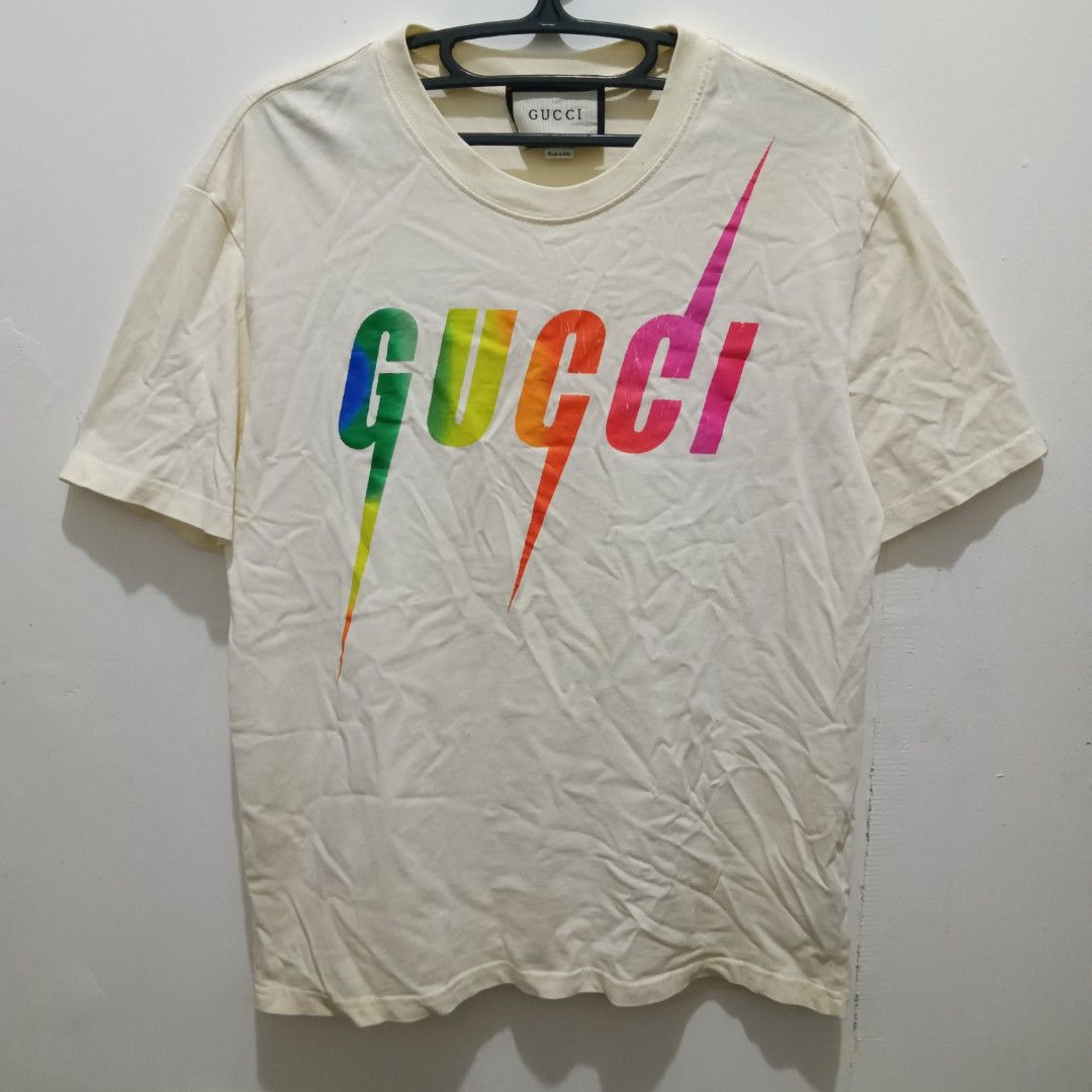 GUCCI Multi Color Logo Shirt (Category: Shirts) located in Caloocan City. Submitted by jaychingsss (Listing ID 1462364433, Image 1). Description: Gucci Multi Color Logo Shirt - 100 20x26 Complete Tags Color Rate: 9/10 (Cream Color) Minor issue: Few hairlines sa print. check pic NEED WASH.