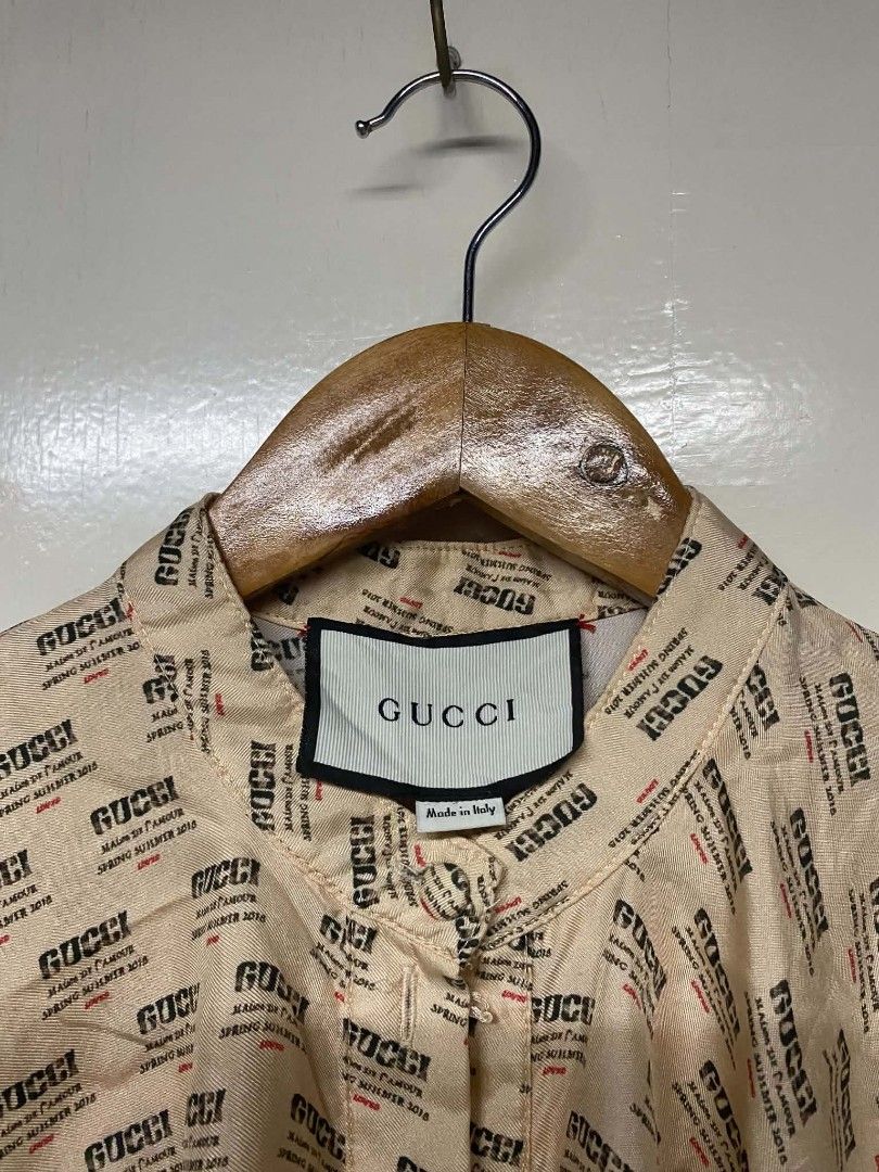Gucci Silk Ruffle Blouse - Spring Summer 2018 (Category: Blouses) located in Pasig City. Submitted by jstnisidor81288 (Listing ID 1462420322, Image 2). Description: - From the Spring Summer 2018 Collection - Features iconic all-over Gucci logo print - Elegant ruffle detail at the neckline - Expertly Made in Italy - Size: 38 - Perfect statement piece for any fashion lover.