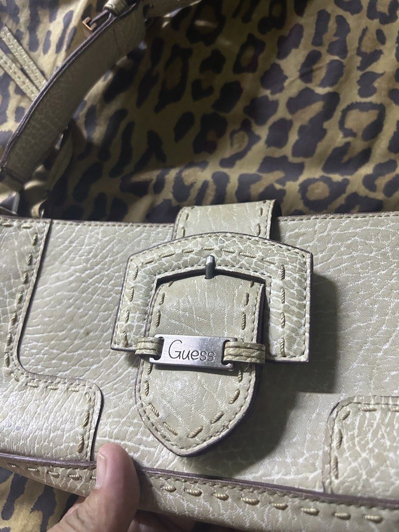 Guess Light Beige Textured Shoulder Bag (Category: Shoulder Bags) located in Quezon City. Submitted by thriftxgoods (Listing ID 1462381146, Image 2). Description: - Light beige Guess shoulder bag - Textured material with contrast stitching - Buckle closure on front flap - Zip pocket on the back - Adjustable buckle strap - Ideal for everyday use.