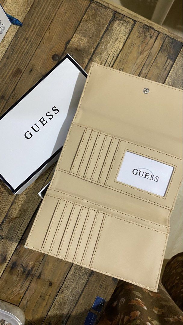 Guess Maong Long Wallet (Category: Wallets & Card Holders) located in Taguig. Submitted by meredith04 (Listing ID 1462263564, Image 3). Description: - bnew item with box and tag - bought from Japan last June 2026 - no issue, all parts are intact Rfs: need funds for my father medical expense.