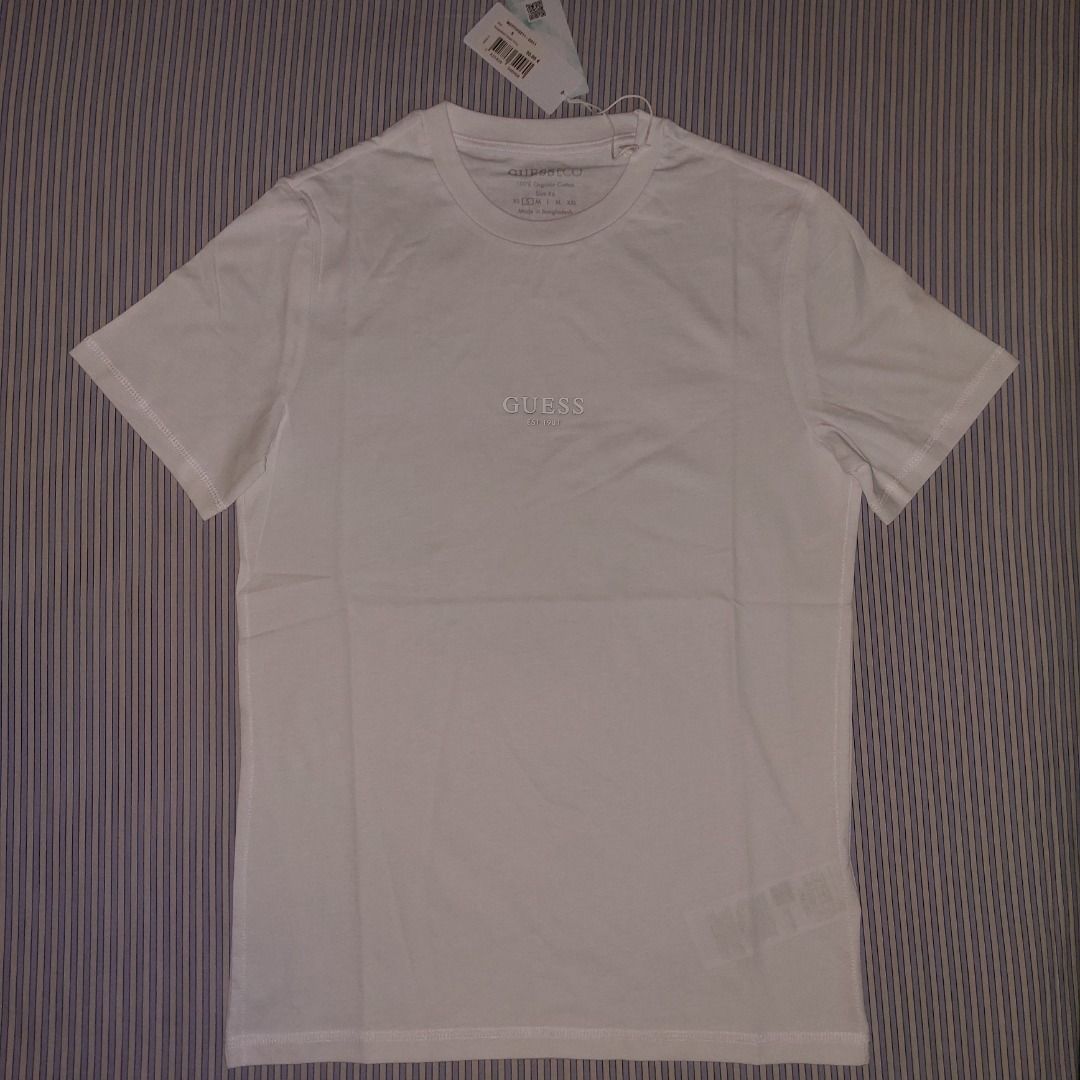 Guess Men's T-Shirt, White, Small (Category: Tshirts & Polo Shirts ) located in Antipolo. Submitted by cyknap2001 (Listing ID 1462271776, Image 2). Description: Guess Men's T-Shirt, White Size Small on tags, actual is 18.5"x26.5" 100% Cotton for natural comfort MOP - payment first sa gcash .