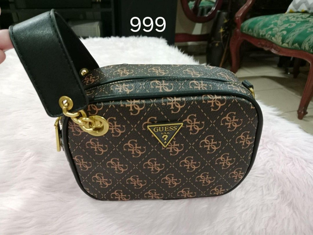 Guess Monogram Bag (Category: Cross-body Bags) located in Pasig City. Submitted by janalopez904 (Listing ID 1462301186, Image 1). Description: - Classic Guess bag - Signature all-over monogram print - Comes with a black strap - Gold hardware details - Zipped compartments for secure storage - Ideal for everyday use.