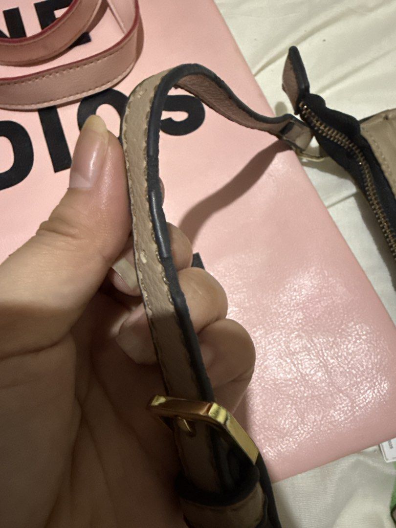 Guess shoulder bag (Category: Shoulder Bags) located in San Fabian. Submitted by declutteringcloset (Listing ID 1462330260, Image 2). Description: Tan Guess shoulder bag. Zipper closure on top and a back pocket. Adjustable strap. Some signs of wear on the strap, as pictured. Gold hardware. Great for everyday use. There’s flaw on strap. You can see it next photo. The rest all goods. RFS: not my style.