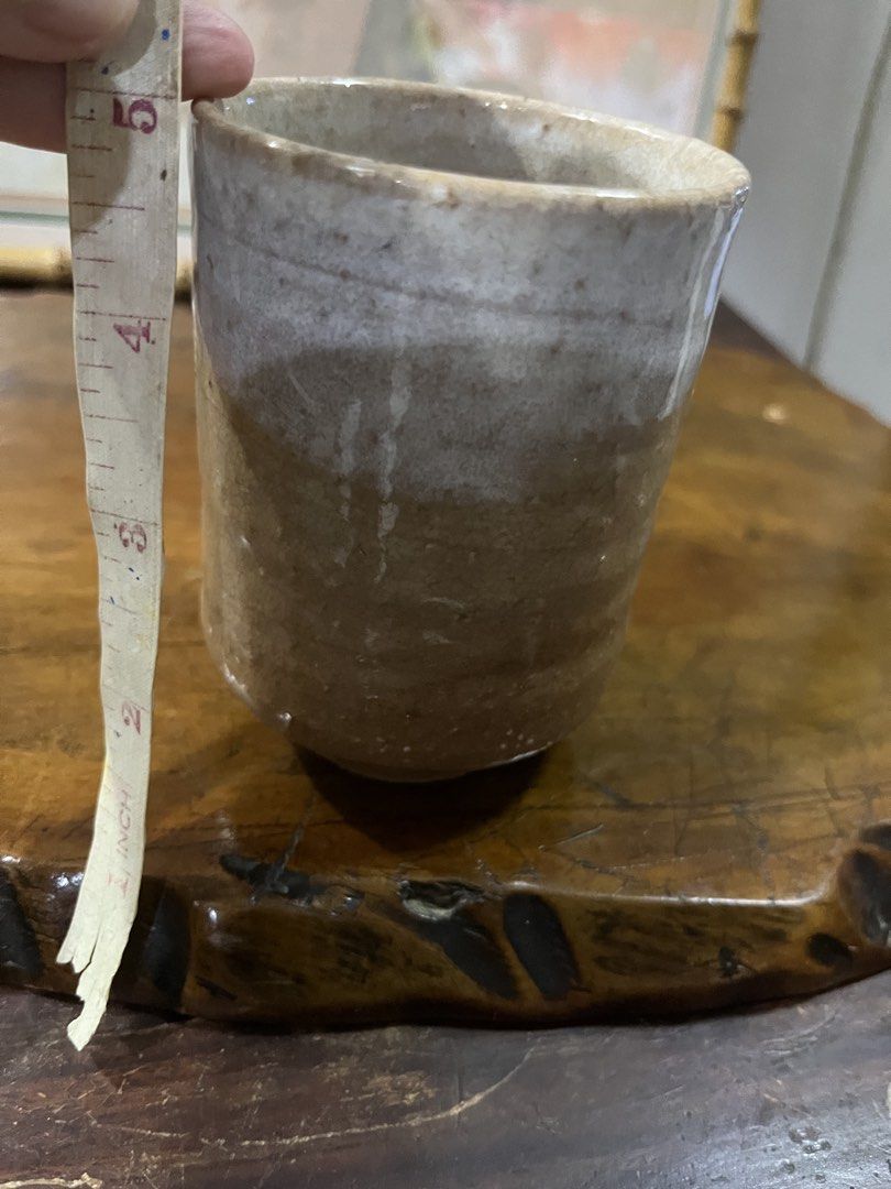 Handmade Ceramic Tea Cup (Category: Coffee & Tea Tableware) located in Taguig. Submitted by minmin_parker (Listing ID 1462361758, Image 3). Description: - Rustic ceramic cup with a natural, earthy glaze. - Features a white wash on the top half for a unique look. - Perfect for enjoying your favorite tea or coffee. - Handcrafted feel adds character to your kitchen or desk. - Creates a cozy and inviting atmosphere..