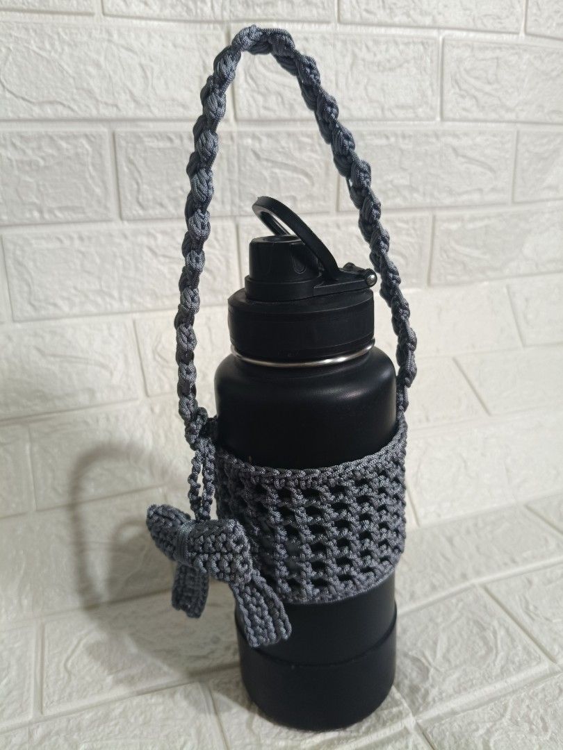 Handmade Crochet Tumbler Holder with Strap (Category: Water Bottles & Tumblers) located in Cavite. Submitted by j_creations18 (Listing ID 1462263154, Image 2). Description: 🩶 Handmade with care 🎀 Cute bow detail for a stylish look 🥤 Fits most standard tumblers and water bottles 👜 Lightweight, durable, and reusable ✨ Perfect for everyday use or as a thoughtful gift Stay hydrated and fashionable wherever you go with this one-of-a-kind handmade 
