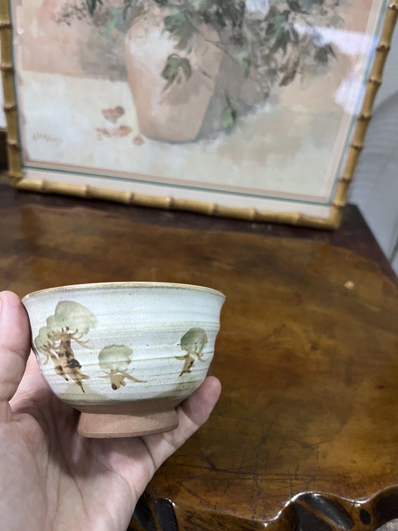 Hand-painted Ceramic Bowl with Tree Design (Category: Vases & Decorative Bowls) located in Taguig. Submitted by minmin_parker (Listing ID 1462371797, Image 3). Description: - Unique hand-painted ceramic bowl - Features a rustic tree design with textured glaze - Unglazed base - Ideal for serving small snacks or as a decorative accent - Artisanal, one-of-a-kind look - Approximately 4 inches in diameter.
