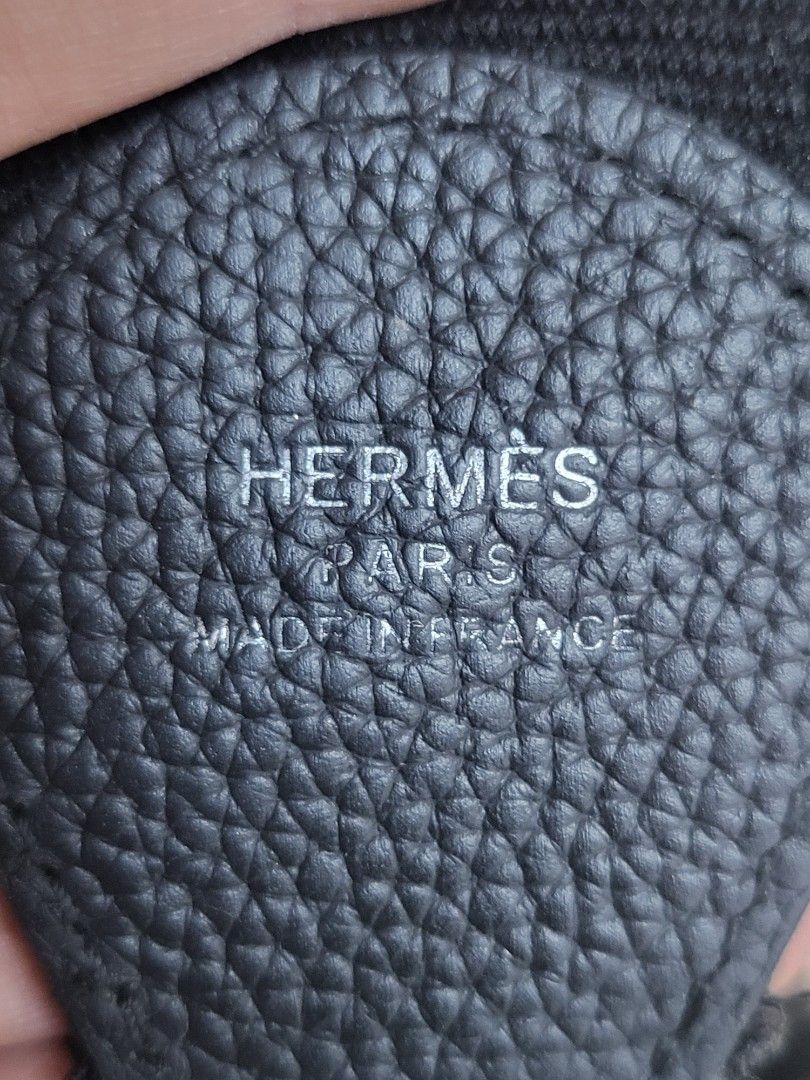 Hermes Black Leather Shoulder Bag (Category: Luxury Bags & Wallets) located in Manila. Submitted by milkymitch23 (Listing ID 1462437022, Image 3). Description: - Hermes black leather shoulder bag - Iconic Hermes 'H' cut-out detail - Adjustable strap for comfortable wear - Interior features a small pocket - Made in France - NGA - PM if interested - may bawas if sure buyer.