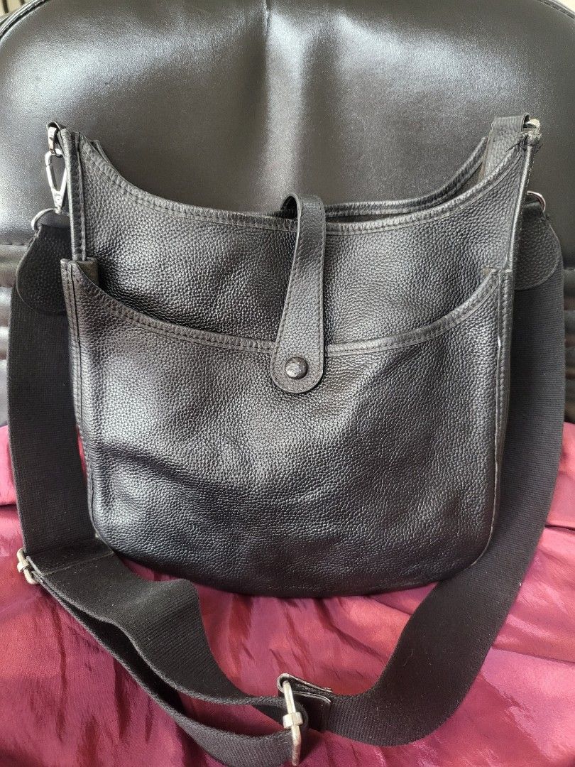 Hermes Black Leather Shoulder Bag (Category: Luxury Bags & Wallets) located in Manila. Submitted by milkymitch23 (Listing ID 1462437022, Image 2). Description: - Hermes black leather shoulder bag - Iconic Hermes 'H' cut-out detail - Adjustable strap for comfortable wear - Interior features a small pocket - Made in France - NGA - PM if interested - may bawas if sure buyer.
