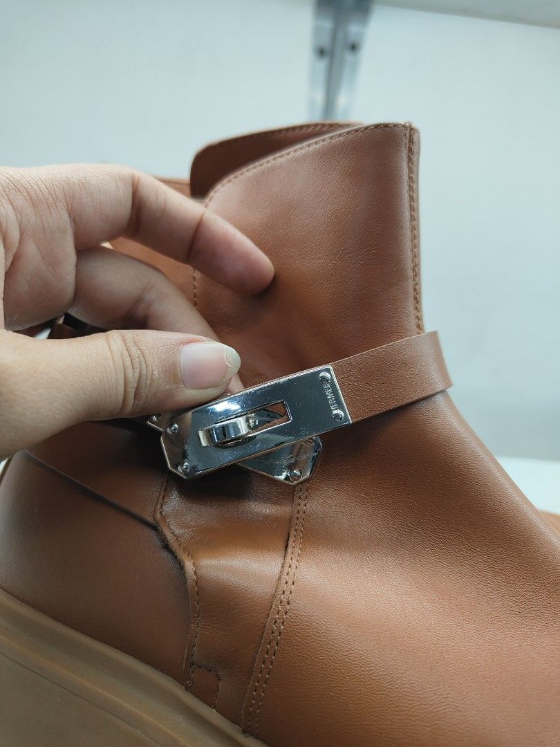 Hermes Brown Leather Ankle Boots with Buckle (Category: Boots) located in Cebu City. Submitted by cherreymie70208 (Listing ID 1462287146, Image 3). Description: - Hermes brown leather ankle boots - Size 37 - Silver buckle detail on side strap - Chunky sole for comfort and style - Perfect for everyday wear.
