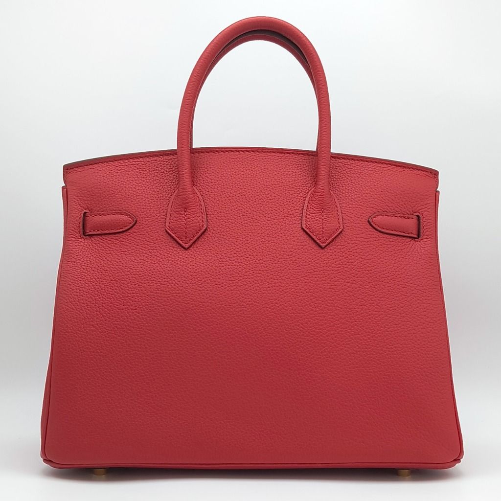 Hermes Birkin 30 Rouge Casaque Red Bag (Category: Luxury Bags & Wallets) located in Cebu City. Submitted by theluxxaffair (Listing ID 1462434481, Image 2). Description: Hermes Birkin 30 bag in red Togo leather with gold-tone hardware. Features dual top handles, signature turn-lock closure and protective feet. Spacious interior with slip and zip pockets. Includes padlock, keys and leather clochette. Length: 30 cm Height: 22 cm Depth: 15 cm Colour:
