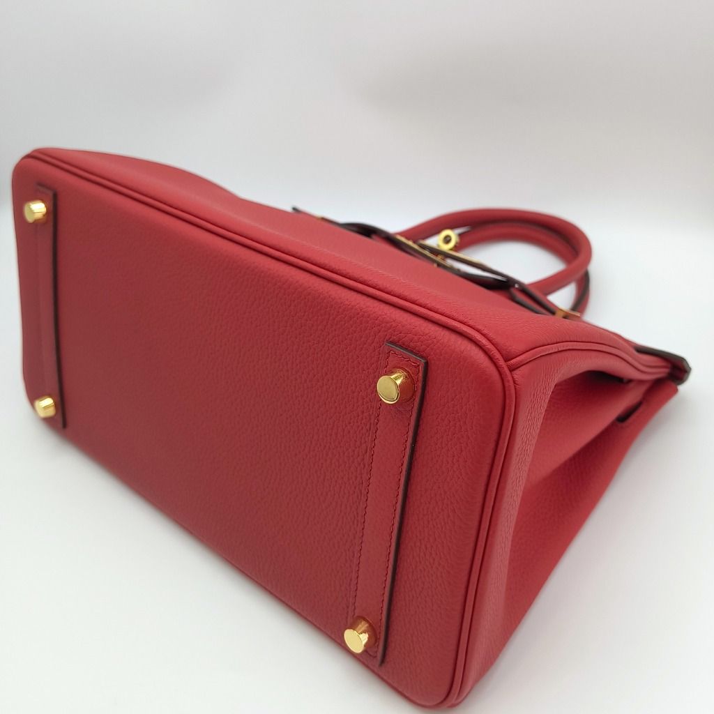 Hermes Birkin 30 Rouge Casaque Red Bag (Category: Luxury Bags & Wallets) located in Cebu City. Submitted by theluxxaffair (Listing ID 1462434481, Image 3). Description: Hermes Birkin 30 bag in red Togo leather with gold-tone hardware. Features dual top handles, signature turn-lock closure and protective feet. Spacious interior with slip and zip pockets. Includes padlock, keys and leather clochette. Length: 30 cm Height: 22 cm Depth: 15 cm Colour: