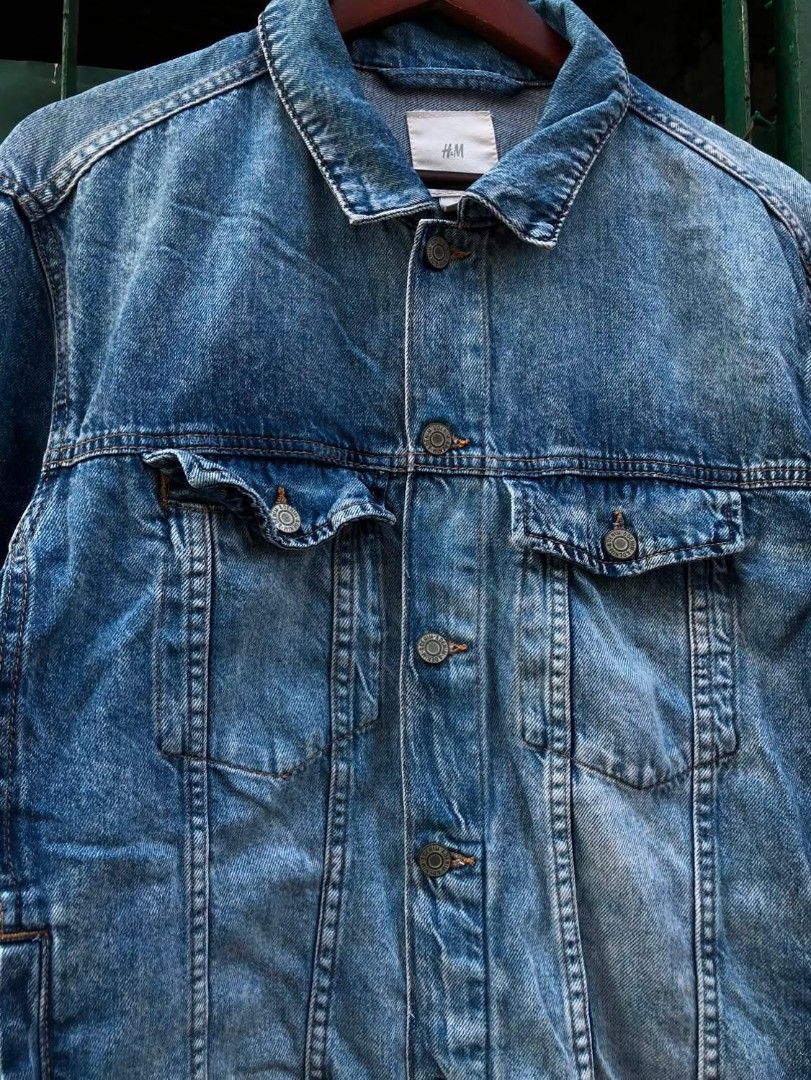 H&M Blue Denim Jacket 23/26.5 (Category: Coats, Jackets and Outerwear) located in Manila. Submitted by kuyanyo (Listing ID 1462350174, Image 3). Description: - Classic blue denim jacket from H&M - Button-up front closure - Two chest pockets - Versatile for layering or wearing solo - Ideal for casual outfits.