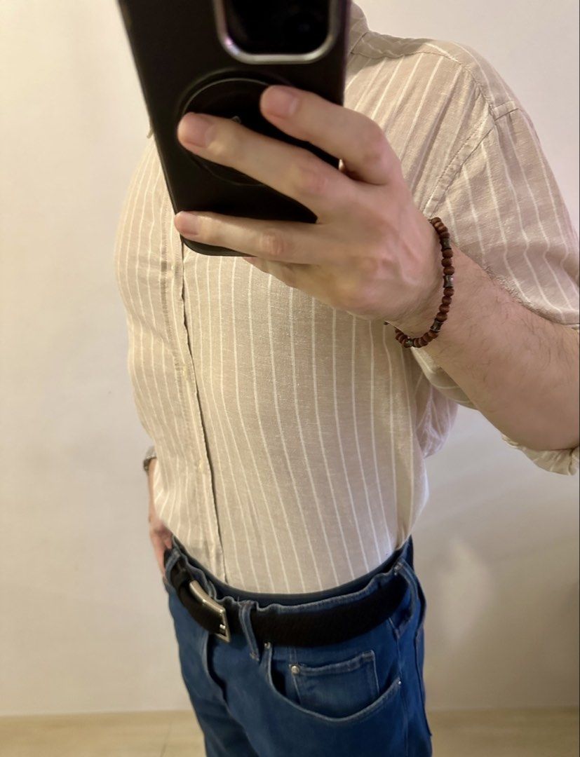 H&M Regular Fit Striped Shirt (Category: Tshirts & Polo Shirts ) located in Manila. Submitted by chris9837 (Listing ID 1462409858, Image 3). Description: - H&M shirt - Beige with thin white vertical stripes - Regular fit - Button-up front with a collar - Sleeves can be rolled up for versatility - Comfortable and casual style Location: Parañaque. .