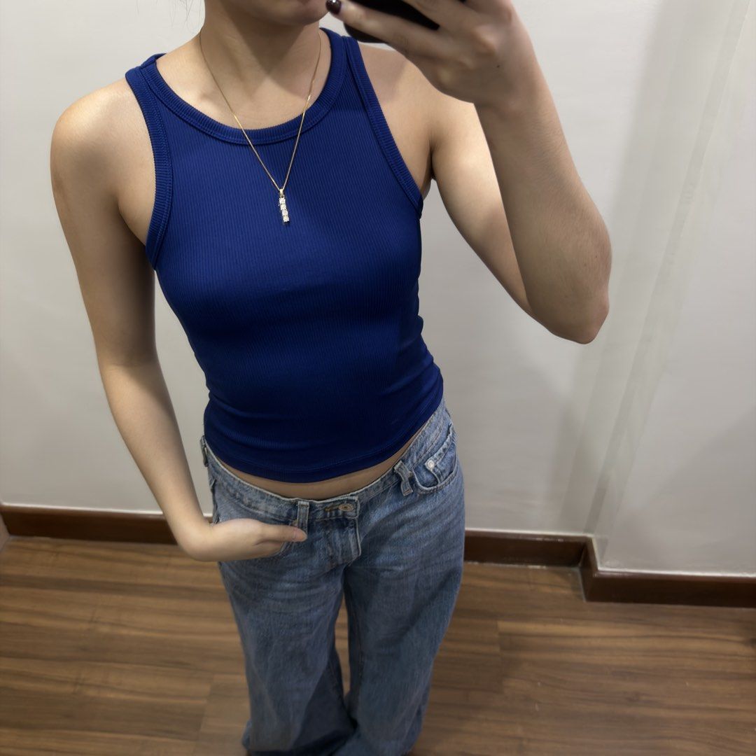 H&M Ribbed Navy Blue Tank Top (Category: Sleeveless) located in Quezon City. Submitted by miumuse_ (Listing ID 1462301790, Image 1). Description: - Navy blue ribbed tank top - Stretchy material for a comfortable fit - Perfect for pairing with jeans or skirts - Ideal for layering or wearing on its own - Easy to style and super comfy.