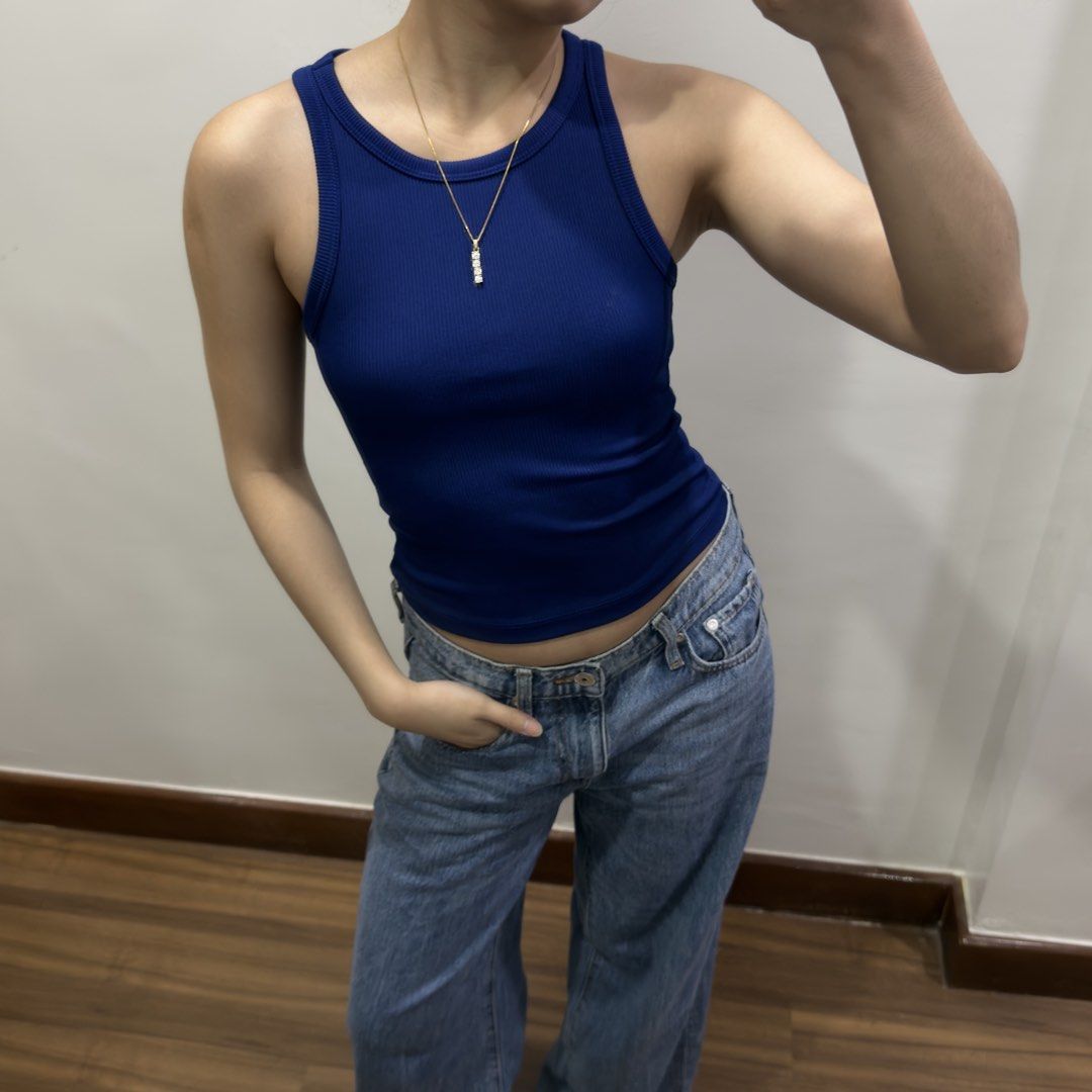 H&M Ribbed Navy Blue Tank Top (Category: Sleeveless) located in Quezon City. Submitted by miumuse_ (Listing ID 1462301790, Image 2). Description: - Navy blue ribbed tank top - Stretchy material for a comfortable fit - Perfect for pairing with jeans or skirts - Ideal for layering or wearing on its own - Easy to style and super comfy.