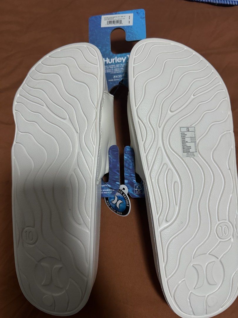 Hurley White Slides Size 10 (Category: Slippers & Slides) located in Caloocan City. Submitted by janine2006 (Listing ID 1462294447, Image 2). Description: - Brand New Hurley Slides - Size: US 10 - Classic slide design with Hurley logo - Textured grip sole - Original MSRP: $35.00 - bought sa US hindi kasya kay hubby My visible dents lng due to packaging and transport. .
