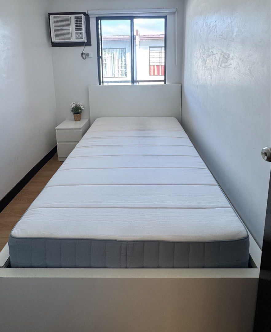 Ikea bed frame and mattress (Category: Bed Frames & Mattresses) located in Cavite. Submitted by mom_declutters111 (Listing ID 1462333514, Image 1). Description: Selling our preloved IKEA twin bed frame with VALEVAG Mattress Size: 90x200cm RFS: switching to loft type bed Location: Imus Cavite.