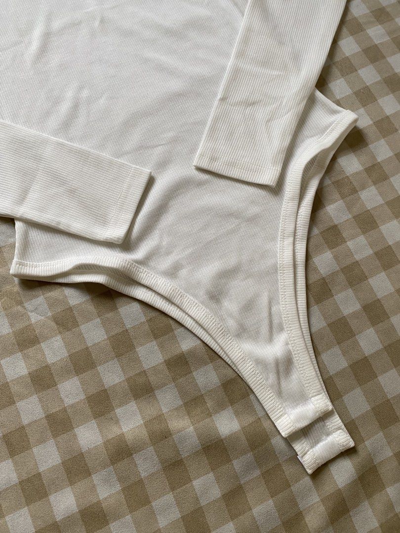 INAWLY Solid Color High Cut Bodysuit (Category: Others Tops) located in Santa Maria. Submitted by closetclearout_co (Listing ID 1462334280, Image 3). Description: Brand: SHEIN Color: Off-White / Warm White Material: Fine Ribbed Knit / Stretch Jersey Poly-Cotton Blend Condition: Brand New / Unworn (Pristine condition, never worn, no tags).