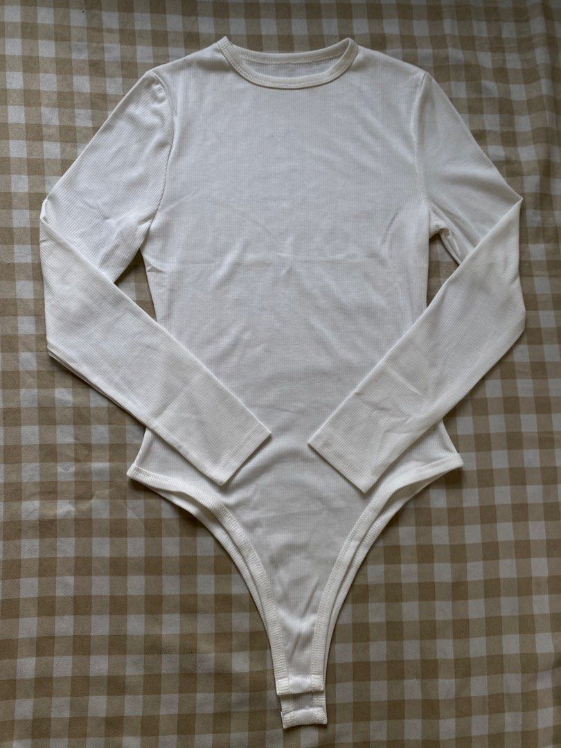 INAWLY Solid Color High Cut Bodysuit (Category: Others Tops) located in Santa Maria. Submitted by closetclearout_co (Listing ID 1462334280, Image 2). Description: Brand: SHEIN Color: Off-White / Warm White Material: Fine Ribbed Knit / Stretch Jersey Poly-Cotton Blend Condition: Brand New / Unworn (Pristine condition, never worn, no tags).
