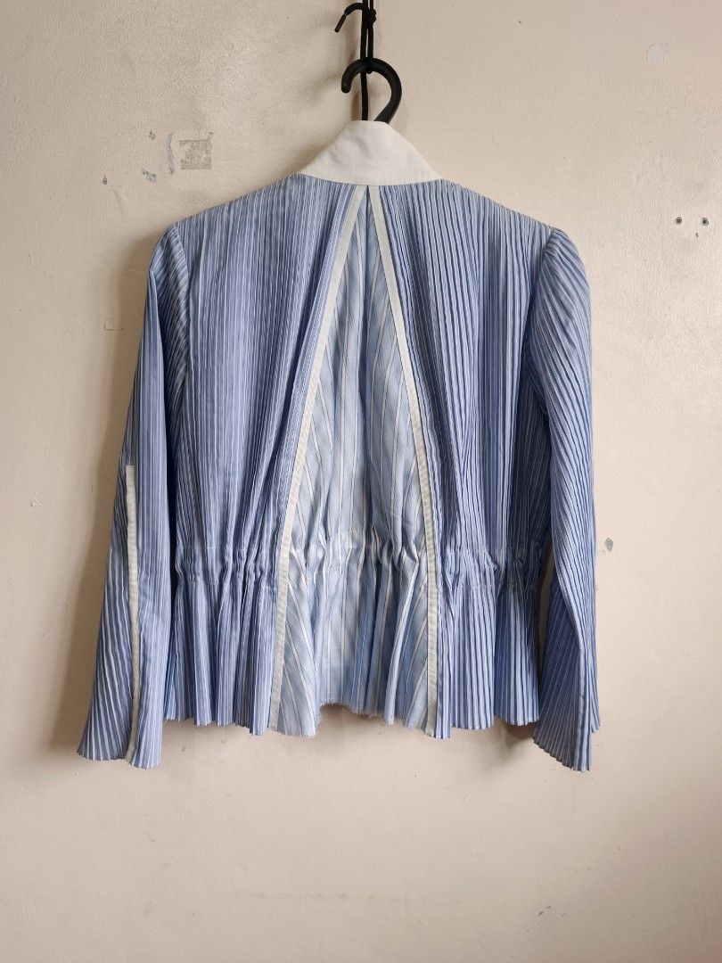 Initial Pleated Light Blue Jacket (Category: Coats, Jackets and Outerwear) located in Dasmarinas. Submitted by jessicamae43174 (Listing ID 1462277302, Image 2). Description: - Light blue pleated jacket from Initial - White contrast trim and collar - Elasticated hem with drawstring detail - Zipper closure - Unique pleated sleeve cuffs - Material: Polyester and cotton blend - Care: Professional dry clean only.