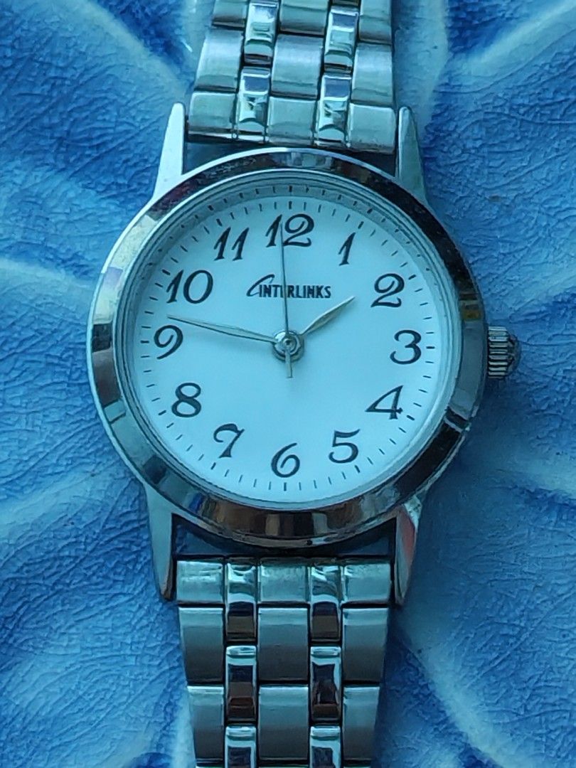 Interlinks Silver-Tone Women's Quartz (Category: Women's Watches) located in Trece Martires City. Submitted by heirloomhoursph (Listing ID 1462428704, Image 1). Description: ✨ Heirloom Hours – Available Piece ✨ Interlinks Silver-Tone Women's Quartz Php 499 + sf Details: ■ Brand/Series: Unbranded ■ Model Number: n/a ■ Movement: Quartz ■ Design Origin: Japan ■ Case Size: 26mm ■ Wrist Size: 20cm (max) ■ Condition: 10/10 ■ Comes with replacement box 