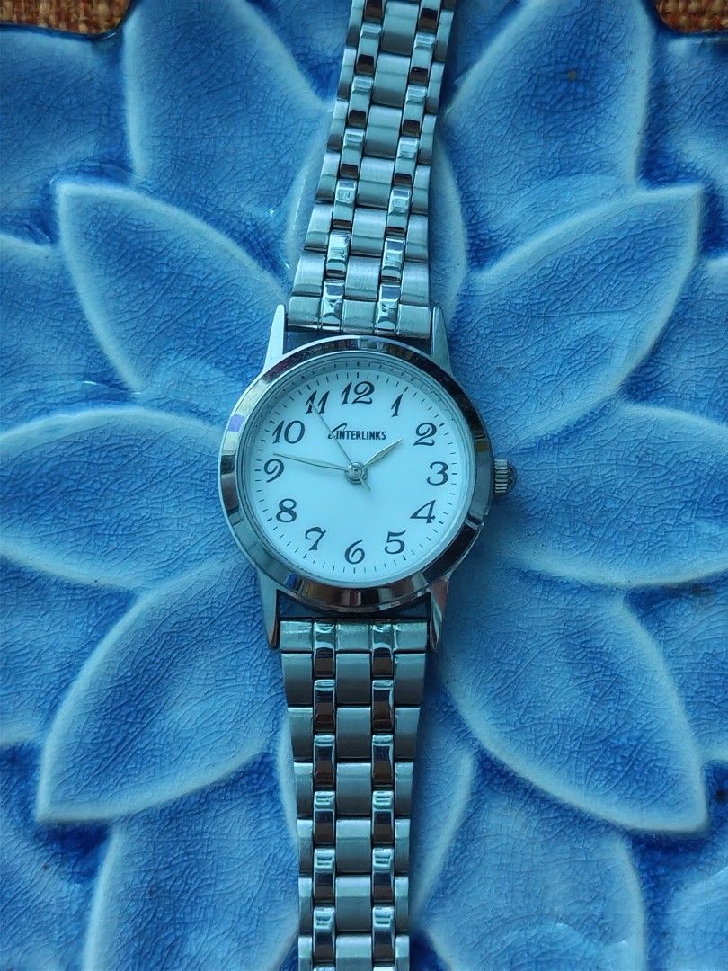 Interlinks Silver-Tone Women's Quartz (Category: Women's Watches) located in Trece Martires City. Submitted by heirloomhoursph (Listing ID 1462428704, Image 2). Description: ✨ Heirloom Hours – Available Piece ✨ Interlinks Silver-Tone Women's Quartz Php 499 + sf Details: ■ Brand/Series: Unbranded ■ Model Number: n/a ■ Movement: Quartz ■ Design Origin: Japan ■ Case Size: 26mm ■ Wrist Size: 20cm (max) ■ Condition: 10/10 ■ Comes with replacement box 