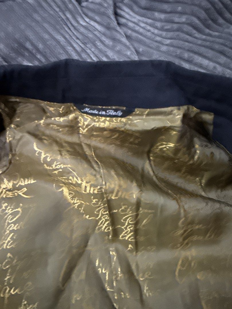 Jean Paul Gaultier Classique Double-Breasted Blazer (Category: Vests) located in Angeles City. Submitted by migs_font29 (Listing ID 1462386907, Image 3). Description: - Classic Jean Paul Gaultier double-breasted blazer - Elegant black exterior - Striking gold patterned lining - Made in Italy - Size: 46 IT / 36 US - A must-have for fashion enthusiasts.