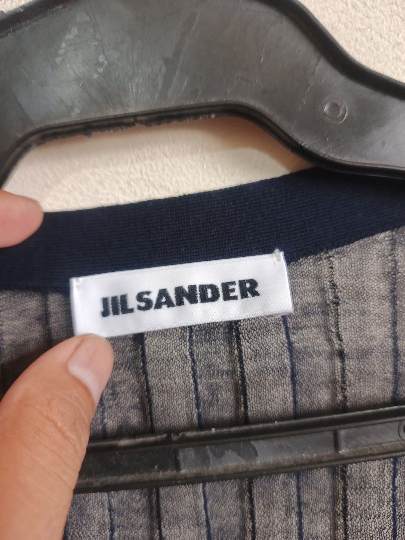 JIL SANDER (Category: Coats, Jackets and Outerwear) located in Dasmarinas. Submitted by jessicamae43174 (Listing ID 1462282812, Image 3). Description: - Navy blue Jil Sander cardigan - Sheer ribbed knit material - Long sleeves - V-neckline - Button-up front - Made in Italy - Size L - Ideal for layering.