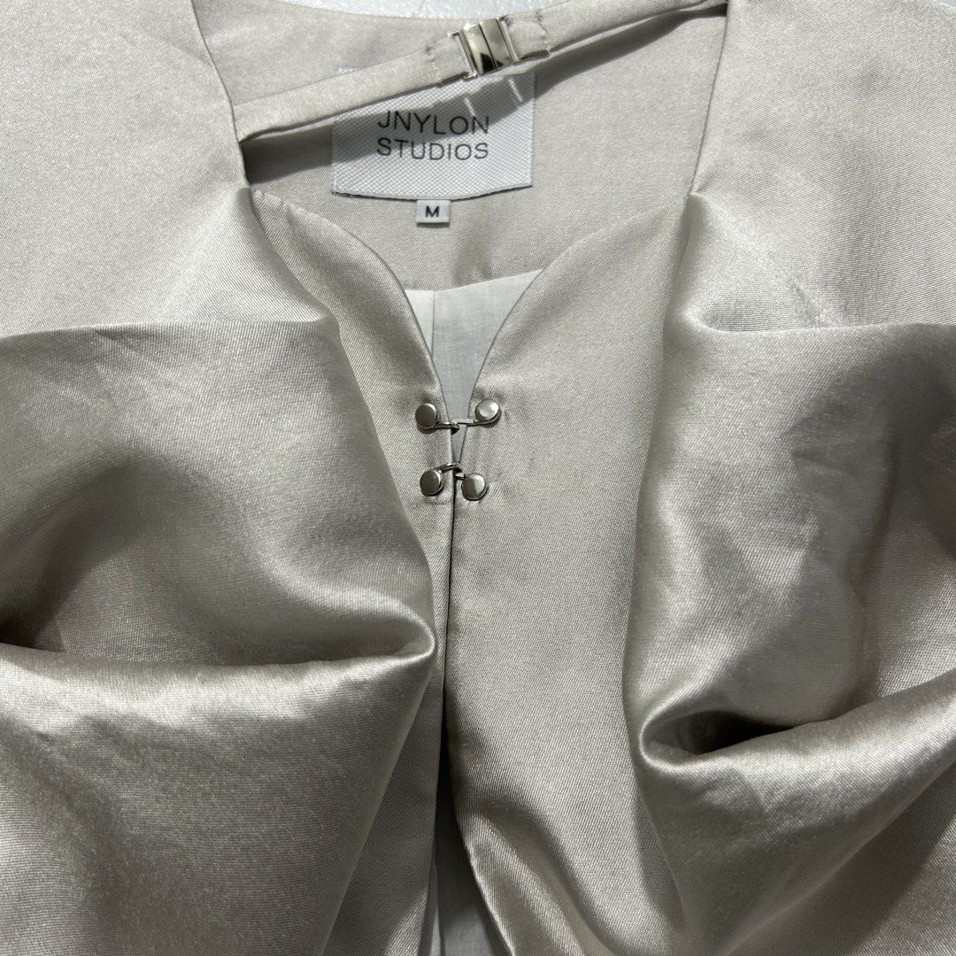JNYLON STUDIOS Avant Garde Top (Medium) (Category: Coats, Jackets and Outerwear) located in Caloocan City. Submitted by lulufanatics (Listing ID 1462426833, Image 3). Description: This is a beautiful avant-garde statement piece from the independent designer label JNYLON STUDIOS. This specific item is a deconstructed satin puff-sleeve top (often styled or categorized as a cropped jacket or blouse) that showcases the brand's signature architectural