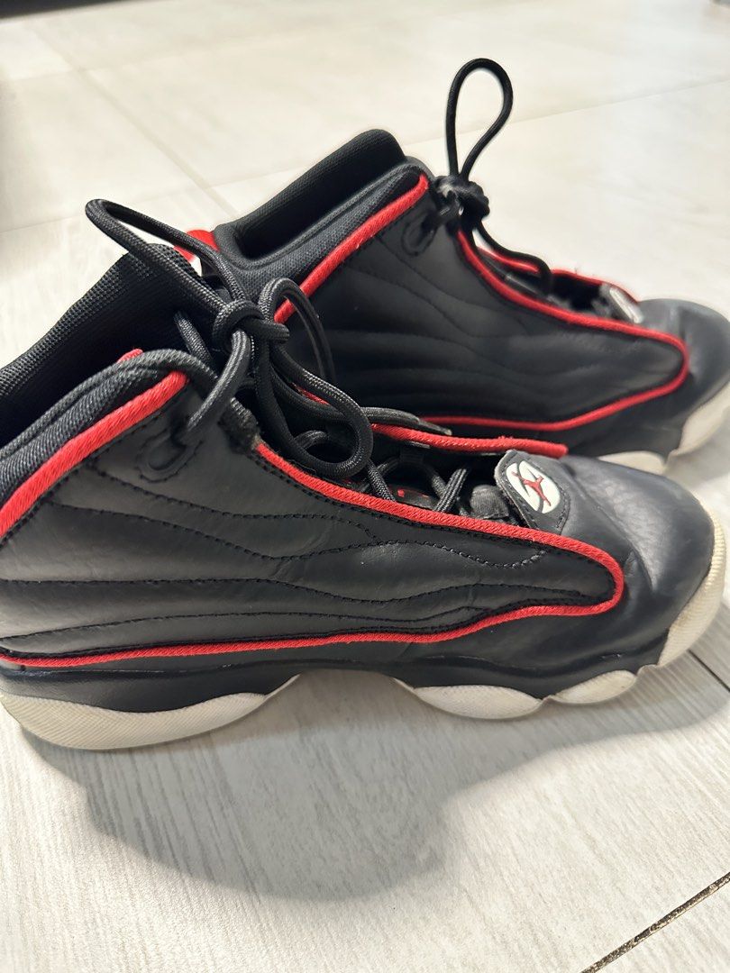 Jordan Pro Strong PS (Category: Babies & Kids Fashion) located in Las Pinas. Submitted by appleberry_915 (Listing ID 1462298338, Image 3). Description: Model: Jordan Pro Strong PS (Preschool) Style: DC7909-061 Size: US 3Y / UK 2.5 / EUR 35 / 22 cm Colorway: Black / White / University Red - High-top design with striking red trim - Iconic Jumpman logo prominently displayed on the heel - Secure black lace-up closure - Selling as is; no box .
