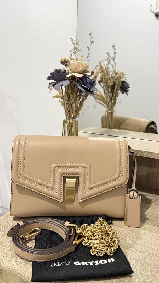 Joy Gryson Naomi (Category: Cross-body Bags) located in Malabon City. Submitted by jonaaa.xyz (Listing ID 1462262368, Image 1). Description: - Beige leather shoulder bag from Joy Gryson - Comes with 2 detachable strap (chain & leather strap) - Original dust bag included - Interior is clean.