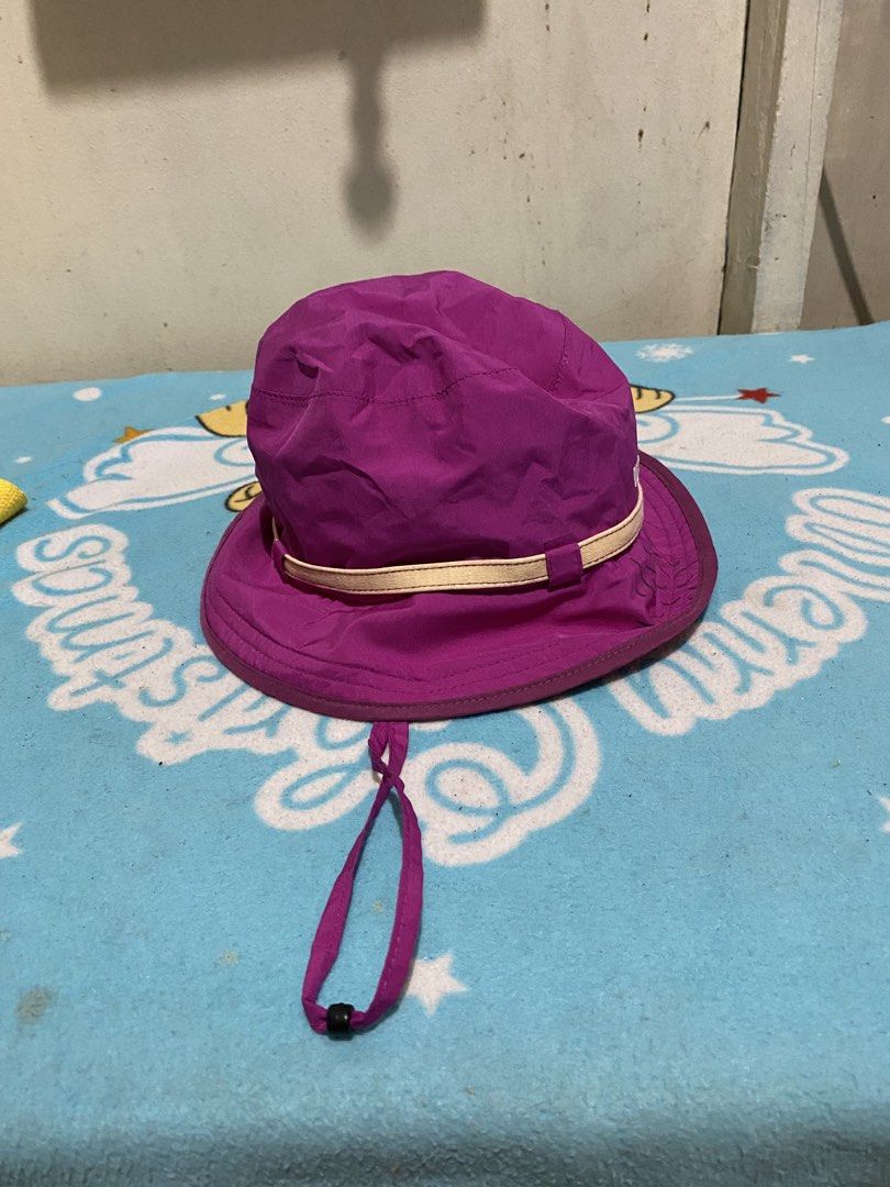 K2 Purple Bucket Hat with Chin Strap (Category: Hats & Beanies) located in Manila. Submitted by resi.diaz (Listing ID 1462411619, Image 1). Description: - K2 purple bucket hat - Light beige band around the crown - Adjustable chin strap with toggle - Subtle floral design on the front - Ideal for sunny outdoor activities - Easy to pack and wear.