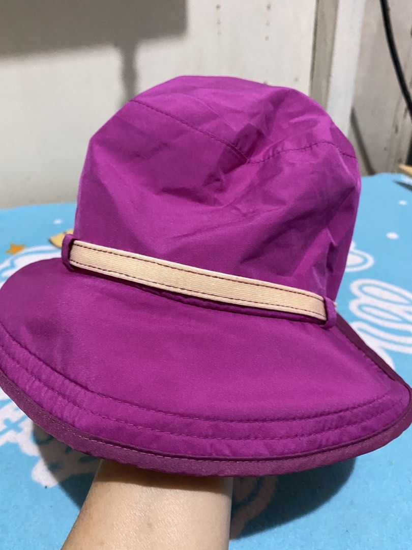 K2 Purple Bucket Hat with Chin Strap (Category: Hats & Beanies) located in Manila. Submitted by resi.diaz (Listing ID 1462411619, Image 2). Description: - K2 purple bucket hat - Light beige band around the crown - Adjustable chin strap with toggle - Subtle floral design on the front - Ideal for sunny outdoor activities - Easy to pack and wear.