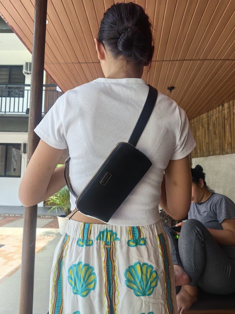 Kate Spade Black Leather Crossbody Bag (Category: Cross-body Bags) located in Quezon City. Submitted by flat.earther23 (Listing ID 1462433134, Image 2). Description: - Brand: Kate Spade - Material: Black Leather - Closure: Zipper - Strap: Adjustable, can be worn crossbody or on shoulder - Size: Small and compact, ideal for essentials - Style: Simple, classic, great for casual outings.