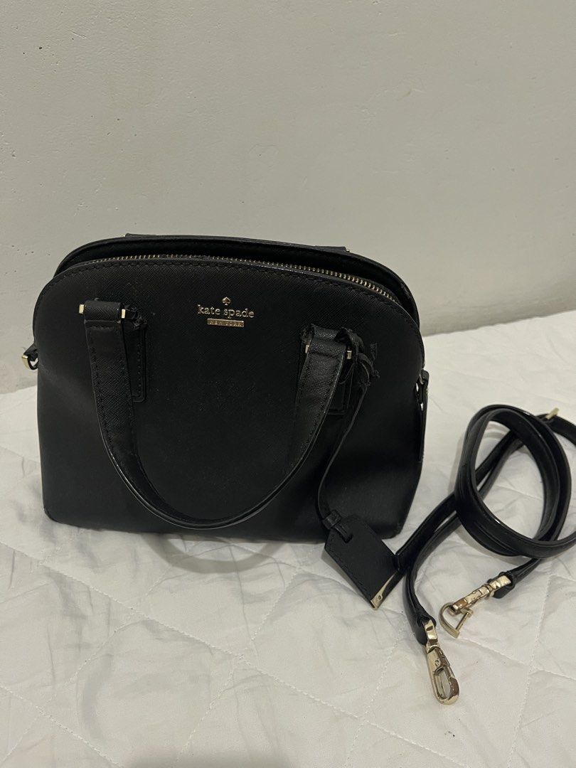 Kate Spade Black Leather Satchel Bag with Strap (Category: Luxury Bags & Wallets) located in Manila. Submitted by lai.p (Listing ID 1462373627, Image 1). Description: - Authentic Kate Spade satchel bag in classic black. - Crafted from premium saffiano leather for durability and style. - Elegant gold hardware details add a touch of luxury. - Spacious and clean interior, perfect for organizing your essentials. - Comes with a detachable shoulder str