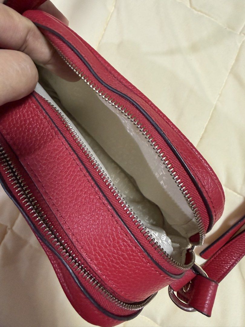 Kate Spade Red Leather Crossbody Bag (Category: Cross-body Bags) located in Paranaque City. Submitted by kimgcham (Listing ID 1462376599, Image 3). Description: - Authentic Kate Spade crossbody bag in vibrant red. - Made from durable, textured pebble leather. - Secure zipper closure to keep your belongings safe. - Adjustable strap for comfortable crossbody wear. - Compact size, ideal for carrying just the essentials. - Stylish silver hardware acc