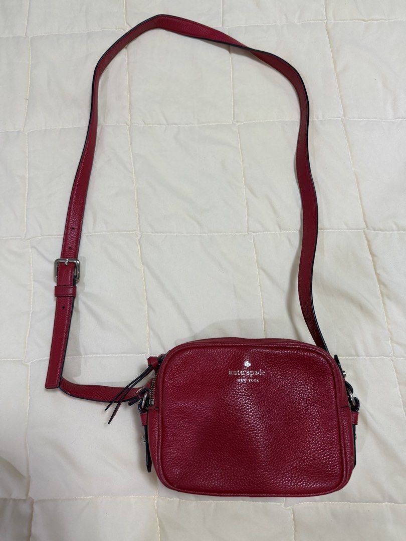 Kate Spade Red Leather Crossbody Bag (Category: Cross-body Bags) located in Paranaque City. Submitted by kimgcham (Listing ID 1462376599, Image 1). Description: - Authentic Kate Spade crossbody bag in vibrant red. - Made from durable, textured pebble leather. - Secure zipper closure to keep your belongings safe. - Adjustable strap for comfortable crossbody wear. - Compact size, ideal for carrying just the essentials. - Stylish silver hardware acc
