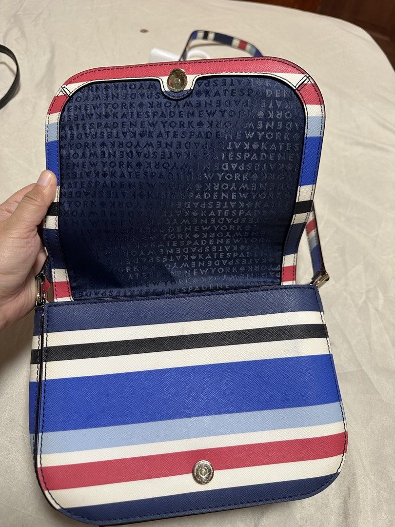 Kate Spade Striped Crossbody Bag (Category: Cross-body Bags) located in Cotabato. Submitted by pawpaw1027 (Listing ID 1462363391, Image 1). Description: - Cute Kate Spade crossbody bag - Fun stripe pattern (blue, red, white, black) - Interior with Kate Spade logo pattern - Snap closure on front and inside - Adjustable strap - Great for everyday use.