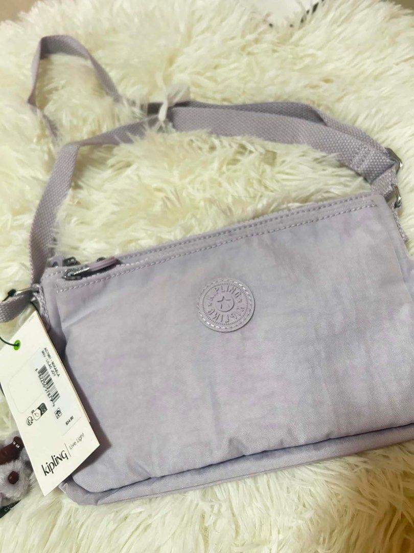 Kipling Active Liraz Crossbody Bag - Light Purple (Category: Cross-body Bags) located in Quezon City. Submitted by ronalynmomoa22 (Listing ID 1462364837, Image 2). Description: - Light purple Kipling crossbody bag - Two zippered compartments for secure storage - Adjustable strap for comfortable wear - Comes with original tags, brand new - Ideal for everyday use or travel - Lightweight and practical design.