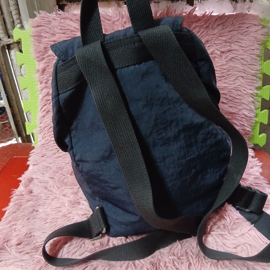Kipling Blue Nylon Backpack with Monkey Charm (Category: Backpacks) located in Caloocan City. Submitted by rame_finds (Listing ID 1462352238, Image 2). Description: - Blue Kipling backpack - Made of durable nylon - Features multiple zippered pockets on the front - Adjustable shoulder straps for comfort - Comes with the signature Kipling monkey charm - Ideal for daily use or travel.