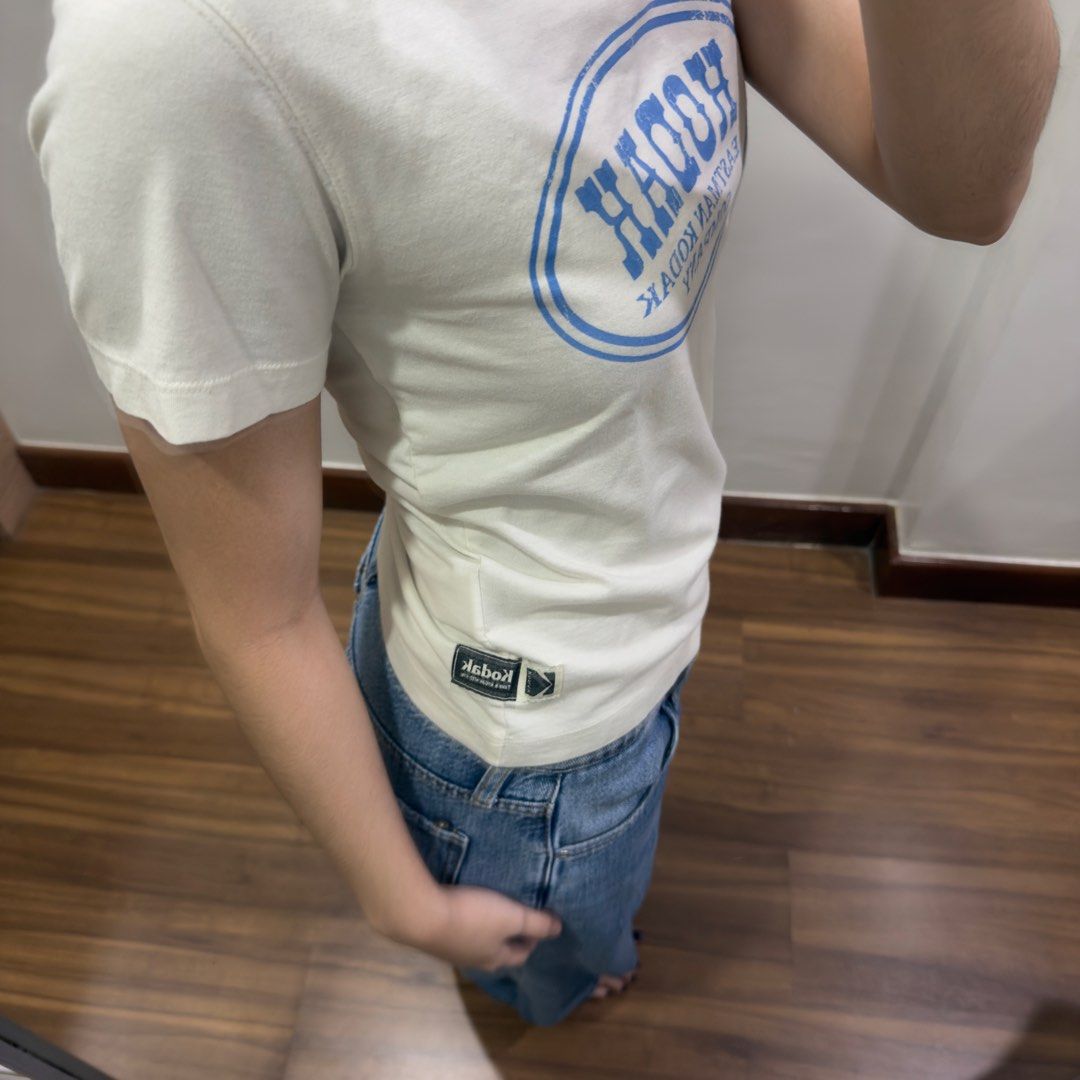 Kodak Graphic T-shirt (Category: Shirts) located in Quezon City. Submitted by miumuse_ (Listing ID 1462307108, Image 2). Description: - White graphic t-shirt - Features blue Kodak Eastman Company print - Short sleeves and crew neck - Ideal for casual wear - Pairs well with jeans or shorts.