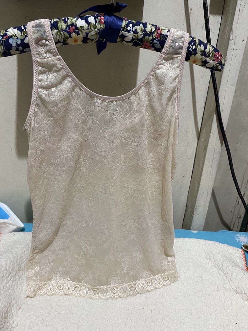 Lace Camisole with Built-in Bra (Category: Undergarments & Loungewear) located in Manila. Submitted by resi.diaz (Listing ID 1462431193, Image 2). Description: - Undersized XL on tag. Fits medium, cup B. - Cream colored camisole - Delicate lace overlay - Built-in bra with light padding - Adjustable straps - Hem with lace trim - Comfortable and supportive for daily wear - Perfect for layering.