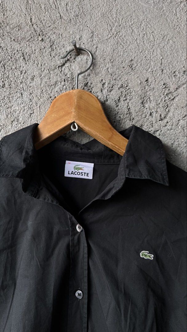 Lacoste Black Long Sleeve Button Up Shirt (Category: Luxury Apparel) located in Cabuyao City. Submitted by bulandos (Listing ID 1462410668, Image 2). Description: - Classic black button-up shirt - Iconic Lacoste crocodile logo embroidered on chest - Made from a comfortable cotton blend - Ideal for casual or smart-casual occasions - Highly versatile, pairs easily with any outfit.