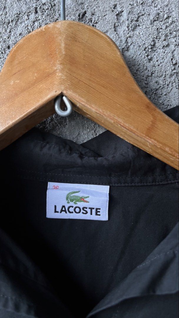 Lacoste Black Long Sleeve Button Up Shirt (Category: Luxury Apparel) located in Cabuyao City. Submitted by bulandos (Listing ID 1462410668, Image 3). Description: - Classic black button-up shirt - Iconic Lacoste crocodile logo embroidered on chest - Made from a comfortable cotton blend - Ideal for casual or smart-casual occasions - Highly versatile, pairs easily with any outfit.