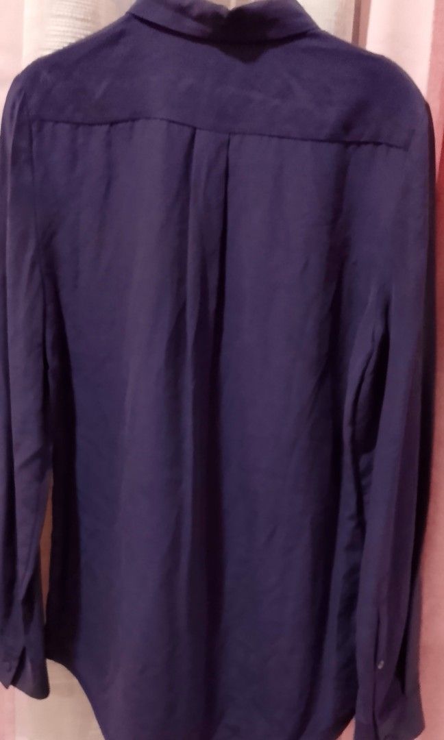 Lacoste Deep purple longsleeve (Category: Blouses) located in Cabanatuan. Submitted by miss.maia (Listing ID 1462435872, Image 2). Description: This deep purple long-sleeve top features a classic point collar, long sleeves with buttoned cuffs, a curved shirttail hemline, and a clean, concealed front button placket.
