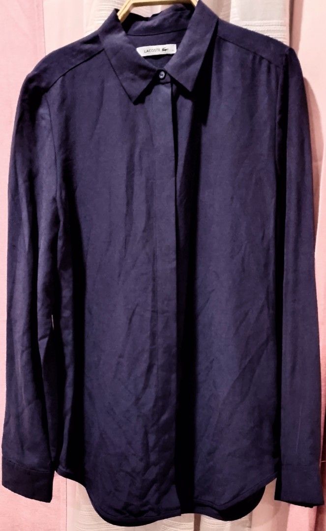 Lacoste Deep purple longsleeve (Category: Blouses) located in Cabanatuan. Submitted by miss.maia (Listing ID 1462435872, Image 3). Description: This deep purple long-sleeve top features a classic point collar, long sleeves with buttoned cuffs, a curved shirttail hemline, and a clean, concealed front button placket.