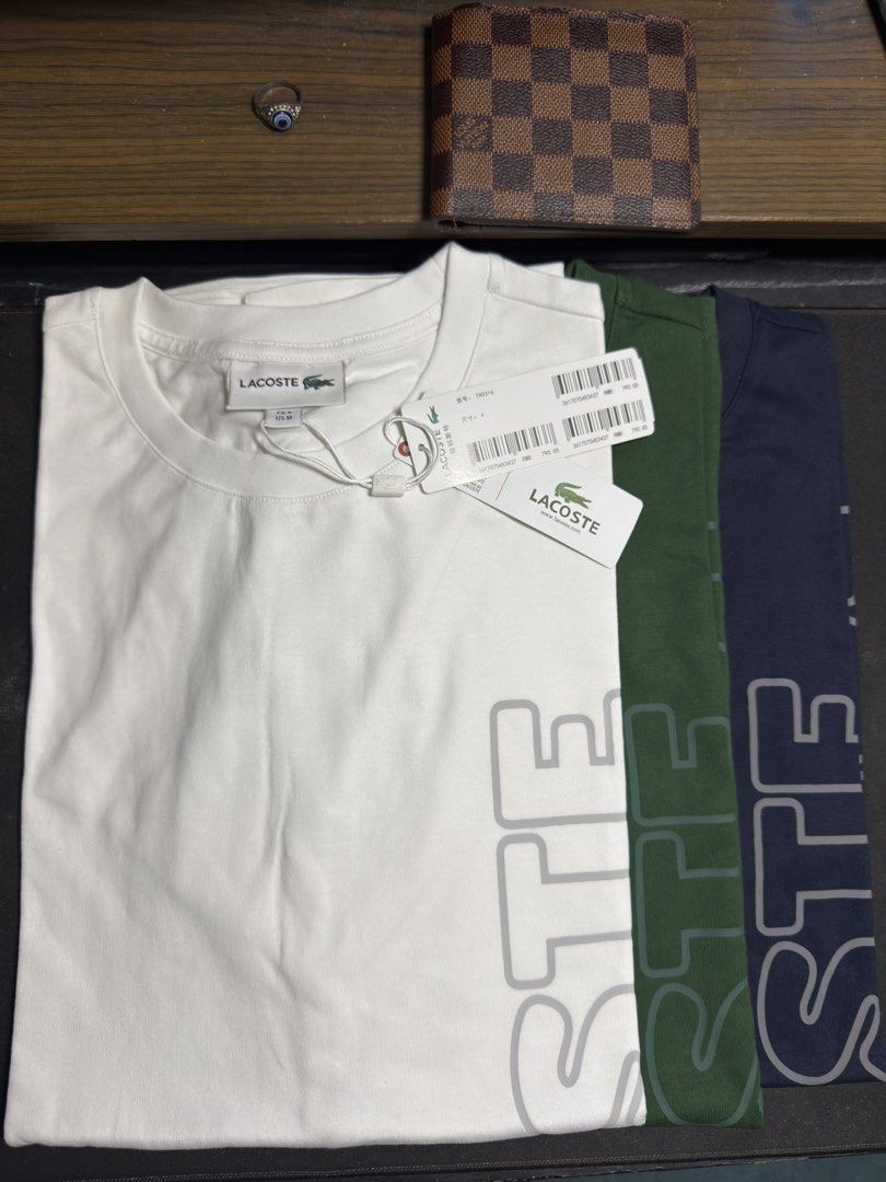 Lacoste Relaxed fit shirt (Category: Tshirts & Polo Shirts ) located in Manila. Submitted by tindero-ng-damit (Listing ID 1462368035, Image 1). Description: Name: Lacoste Relaxed fit shirt Big Spellout with tonal logo Bnew and never worn Size 4 - M fits Large Measurement: 22 Width X 28 Length Colors: WHITE-NAVY-GREEN BELOW SRP.